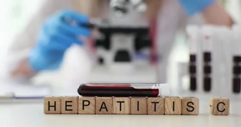 Text Hepatitis C of cubes and blood sample in laboratory Stock Footage 277568123