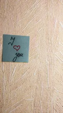 Text I love you on post it. Writing on colorful sticky note. Bucharest, Rom.. Stock Photos