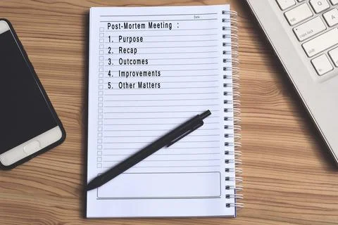 Text label on notepad with laptop and smartphone Stock Photos