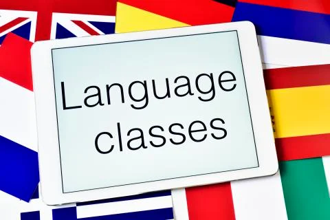 The text language classes in the screen of a tablet computer surrounded by fl Stock Photos