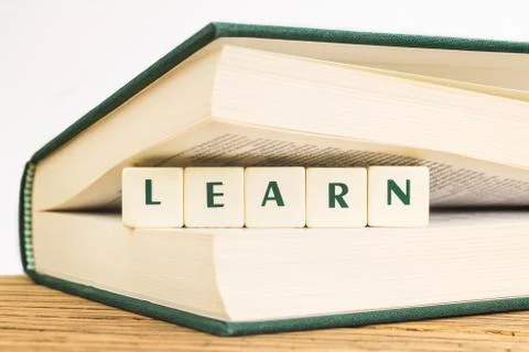 Text learn with dice Stock Photos