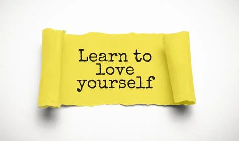 Text Learn to love yourself appearing behind ripped brown paper Stock Photos