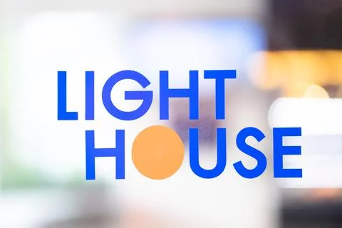 The text LIGHT HOME on the background uses a light effect Stock Photos