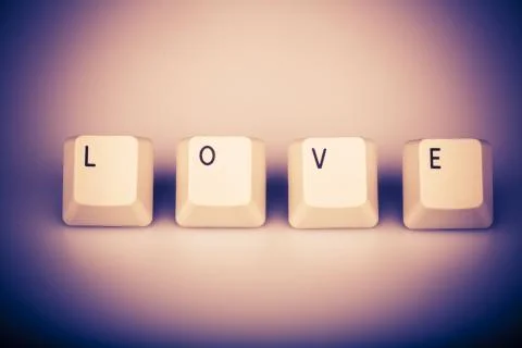 Text love formed with computer keyboard keys on white background Stock Photos