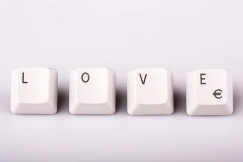 Text love formed with computer keyboard keys on white background Stock Photos