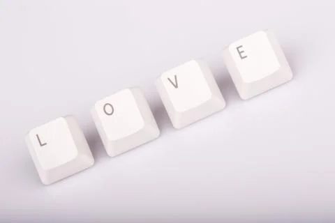 Text love formed with computer keyboard keys on white background Stock Photos