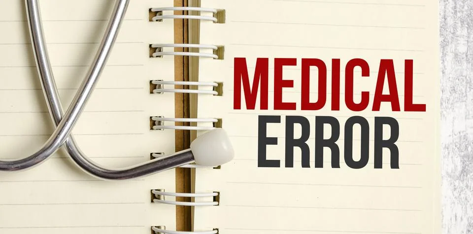 Text MEDICAL ERROR words on a notebook on wooden table Stock Photos