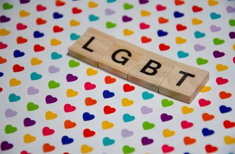 Text message LGBT for protest action. Selective focus on Lettering LGBT. Stock Photos