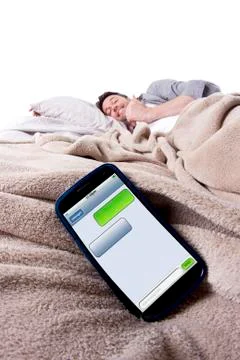 Text Messages In Bed Stock Photos