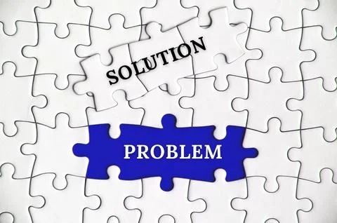 Text on missing jigsaw puzzle - Solution and problem Stock Photos