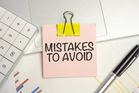 Text mistakes to avoid. Written words on paper notebook . workplace. Business Stock Photos