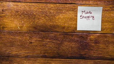 Text Mobile Shopping on post it. Writing on sticky note. Copy space. Buchar.. Stock Photos