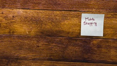 Text Mobile Shopping on post it. Writing on sticky note. Copy space. Buchar.. Stock Photos