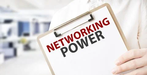 Text NETWORKING POWER on white paper plate in businessman hands in office. .. Stockfoto's