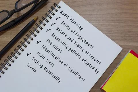 Text on notepad with yellow note and study glasses. Business concept Stock Photos