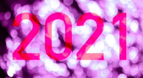 Text with the number of the year 2021 with a background of bright lights. Illustrazione stock