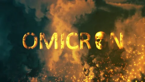 Text omicron with human skull on bg with fire and smoke - loop video Stock Footage 204097793