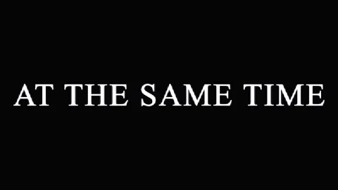 Text overlay AT THE SAME TIME repeated against black background cinematic m.. Video stock 344036020