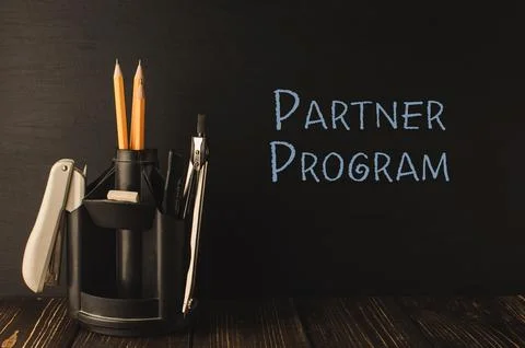 Text Partner Program and stands for pens and pencils Stock Photos