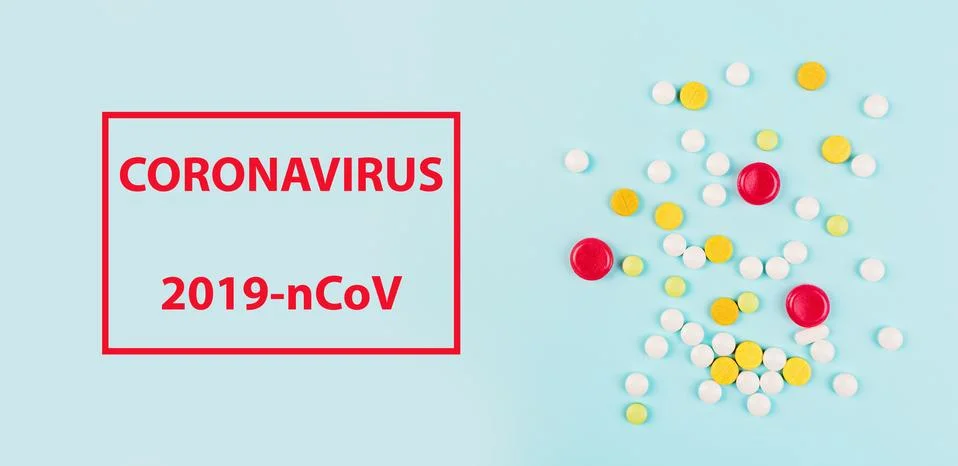 Text phrase Coronavirus on a blue background with drugs. Vaccine development. Foto stock