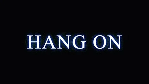 Text phrase 'Hang On' illuminated with subtle light effects on a dark backg.. Stock Footage 345622237