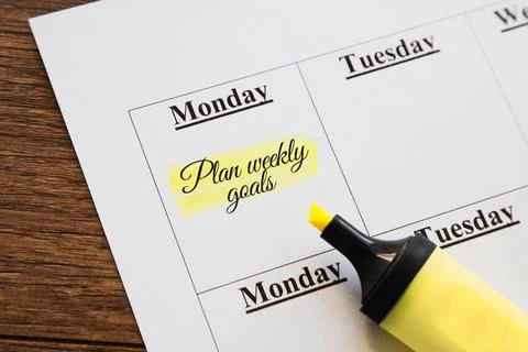 Text Plan weekly goals written on a calendar with a highlighted note and a .. Stock Photos