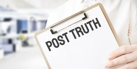 Text Post Truth on white paper plate in businessman hands in office. Business Stock Photos