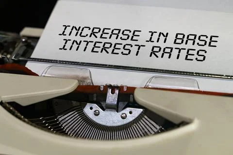 The text is printed on a typewriter - increase in base interest rates Foto stock