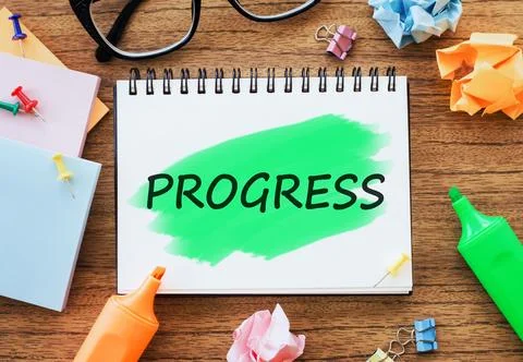 Text PROGRESS written in notepad on office table Stock Illustration