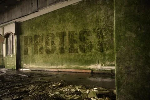 Text protest on the dirty old wall in an abandoned ruined house Stock Photos