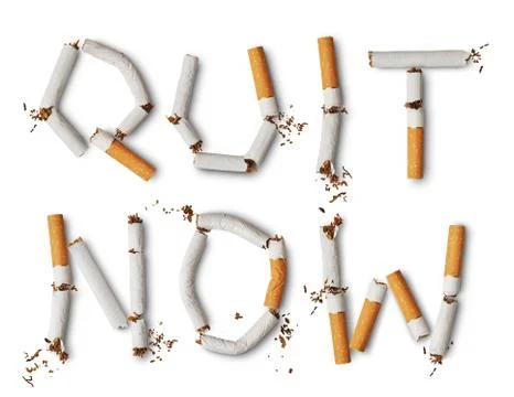 Text quit now made from broken cigarettes Stock Photos
