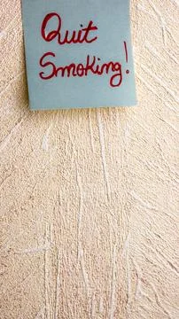 Text Quit Smoking on post it. Writing on colorful sticky note. Copy space. .. Stock Photos