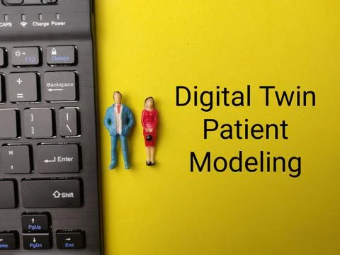 Text reading Digital Twin Patient Modeling sits on a yellow surface beside .. Stock Photos