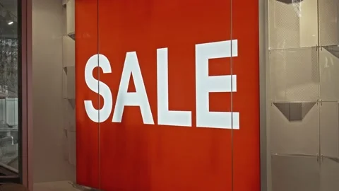 Text on the red board window of the store with the inscription sale Stock Footage 141062959