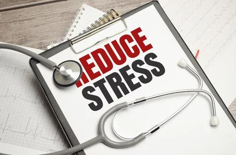 Text Reduce stress on a white background with stethoscope Stock Photos