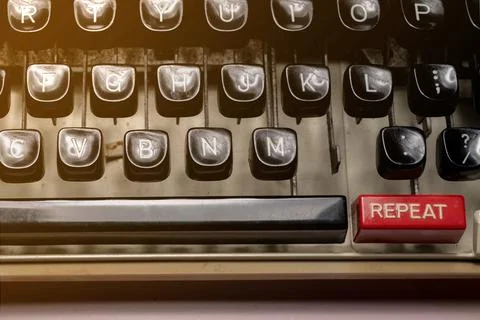 Text of repeat on a vintage typewriter button Stock Photos