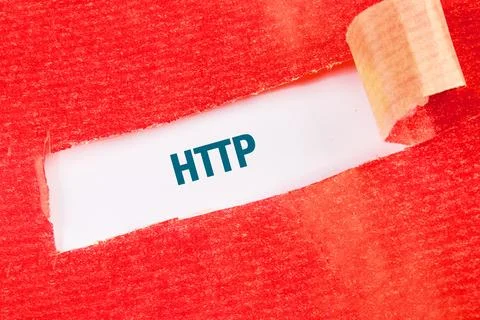 Text revealing HTTP through a ripped piece of tape on red background Foto stock