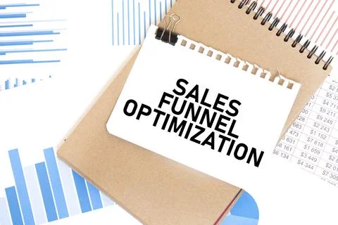 Text sales funnel optimization on white paper sheet and brown paper notepad.. Stock Photos