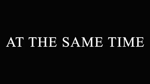 Text AT THE SAME TIME repeating across screen in cinematic motion with subt.. Stock Footage 344032346