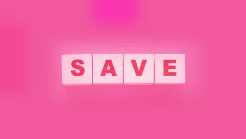 Text SAVE on a wooden cube blocks on pink background. Money saving concept Stock Photos