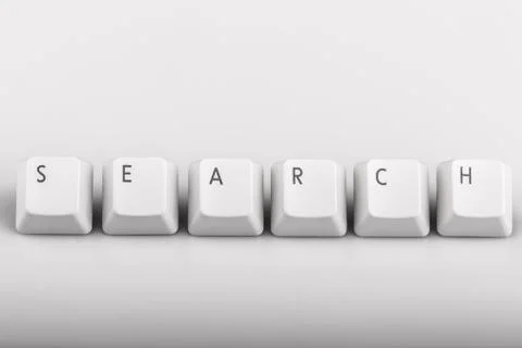 Text search formed with computer keyboard keys on white backgrou Stock Photos
