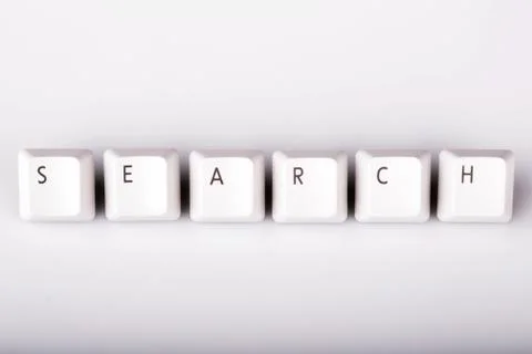Text search formed with computer keyboard keys on white backgrou Stock Photos