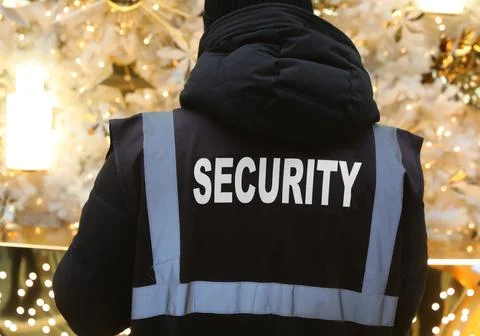 Text security on the jacket of the security guard during surveillance in th.. Stock Photos