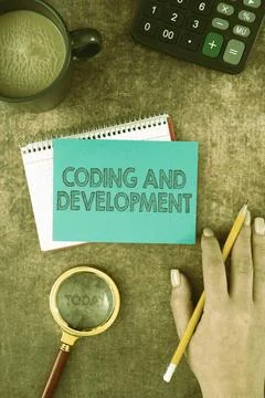Text showing inspiration Coding And Development. Business concept Programming Stock Photos