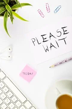 Text showing inspiration Please Wait. Concept meaning to pause any implemented Stock Photos