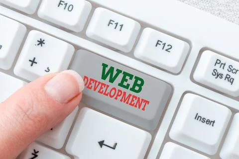 Text showing inspiration Web Development. Concept meaning work involved in Stock Photos