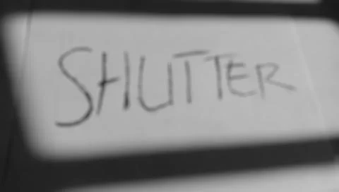 Text "shutter" with black and crayon background Stockfoto's