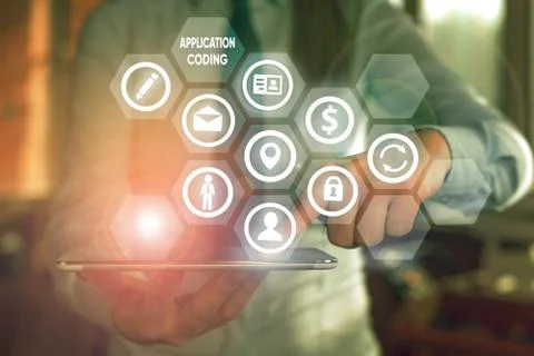 Text sign showing Application Coding. Conceptual photo process by which a mobile Stock Photos