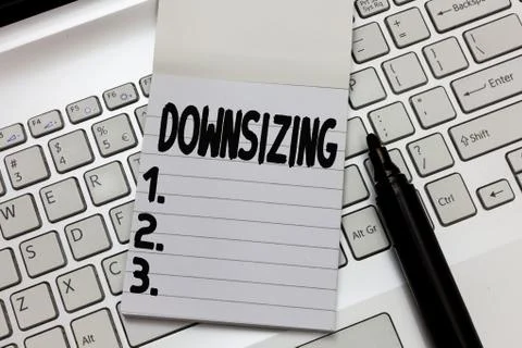 Text sign showing Downsizing. Conceptual photo Make a company smaller by Foto stock