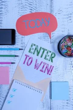 Text sign showing Enter To Win. Conceptual photo exchanging something value for Stock Photos